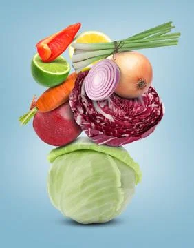 Stack of different vegetables and fruits on pale light blue background 스톡 사진