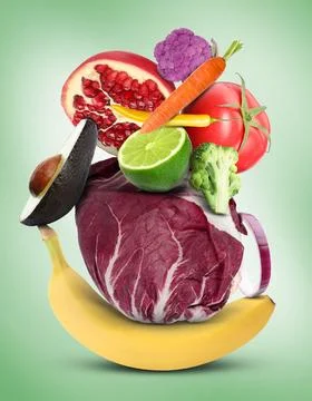 Stack of different vegetables and fruits on pale light green background 스톡 사진