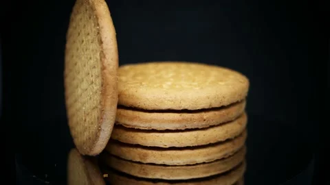 Stack Of Digestive Biscuits Isolated On Black Background. - rotating shot, Stock Footage 142693800