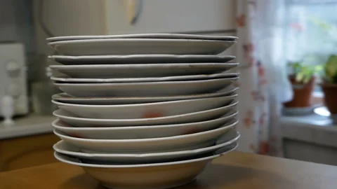 Stack of dinner plates moving around kitchen, parallax effect Video stock 161883051