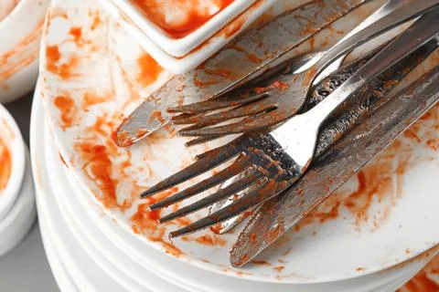 Stack of dirty dishes with cutlery, closeup 写真素材
