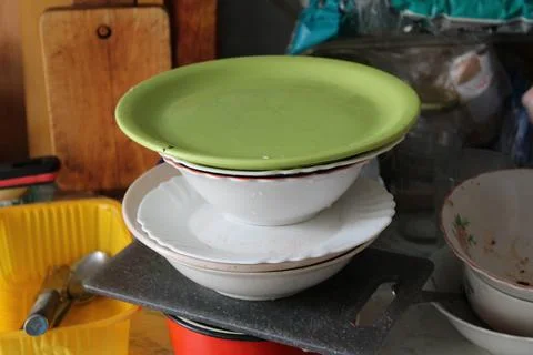 Stack of Dirty Dishes in Kitchen Stock Photos