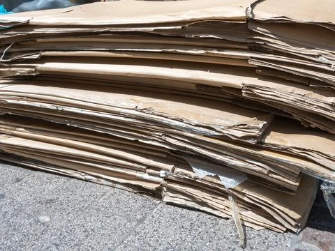 Stack of dirty old paper box on the street. Stock Photos