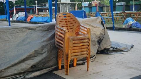 Stack of Dirty Plastic Chairs Stock Photos