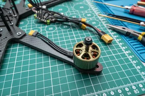 Stack of disassembled sport FPV drone bodies lies on a work table, alongsid.. 写真素材