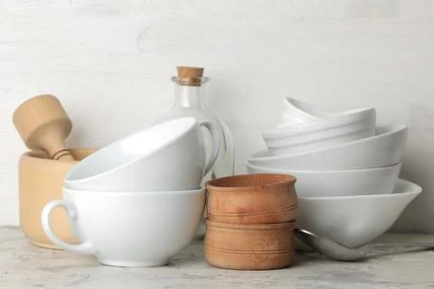 A stack of dishes. tableware on a light concrete background. dishes for servi Stock Photos