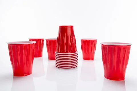 Stack of disposable red plastic cups isolated on a white background 库存照片