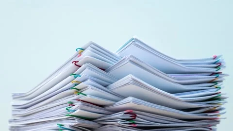 Stack of document paper with colorful paperclip Stock Footage 146019375