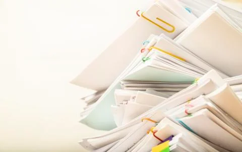 Stack of document paper with colorful paperclip with copy space Stock Photos