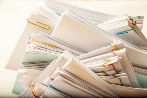 Stack of document paper with colorful paperclip with copy space Stock Photos
