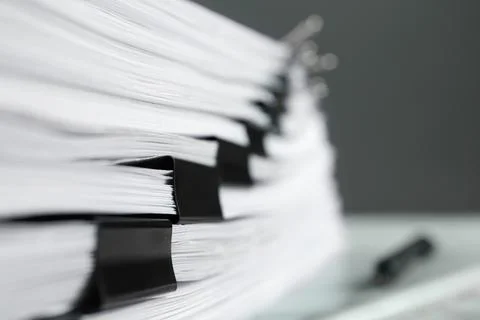Stack of documents with binder clips on marble table, closeup Stock Photos