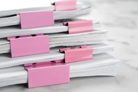 Stack of documents with binder clips on marble table, closeup 스톡 사진