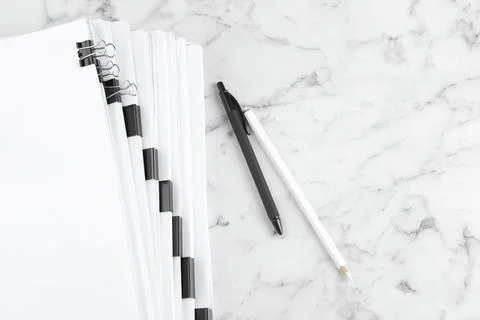Stack of documents with binder clips on marble table, top view 스톡 사진