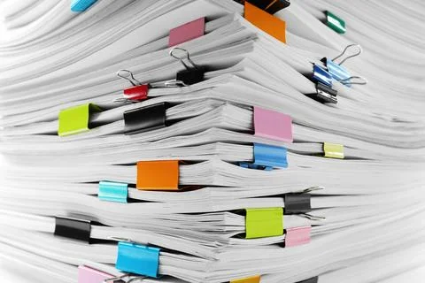 Stack of documents with colorful binder clips, closeup 스톡 사진