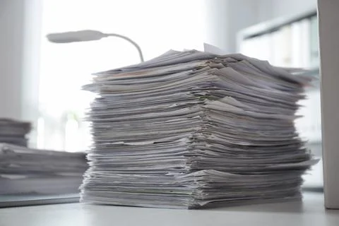 Stack of documents on desk in office 스톡 사진