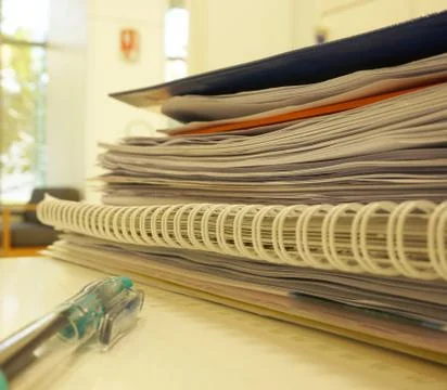 Stack of documents in office desk Фото