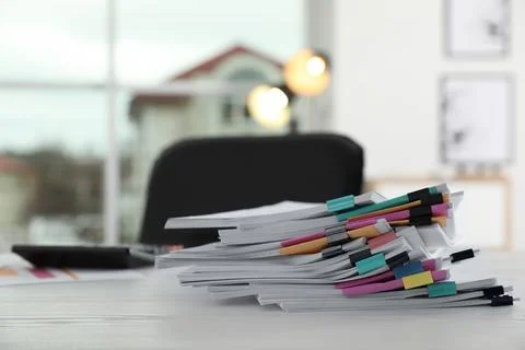 Stack of documents with paper clips on office table. Space for text 写真素材