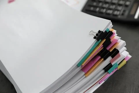Stack of documents with paper clips on office table. Space for text Stock Photos