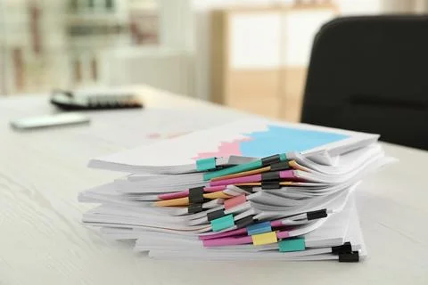 Stack of documents with paper clips on office table 库存照片