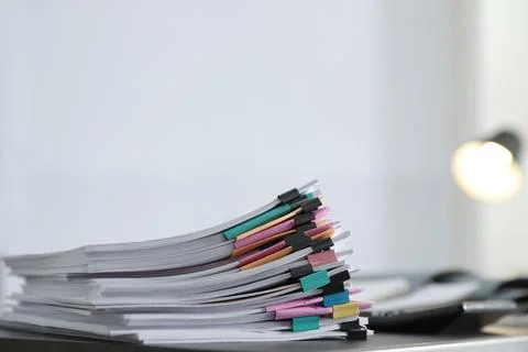 Stack of documents with paper clips on office table. Space for text 库存照片