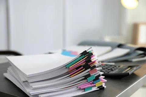 Stack of documents with paper clips on office table. Space for text Stockfoto's