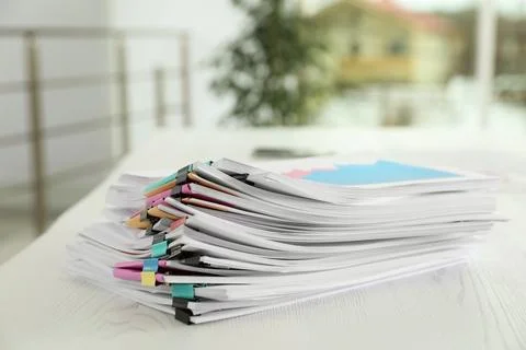 Stack of documents with paper clips on office table. Space for text 스톡 사진