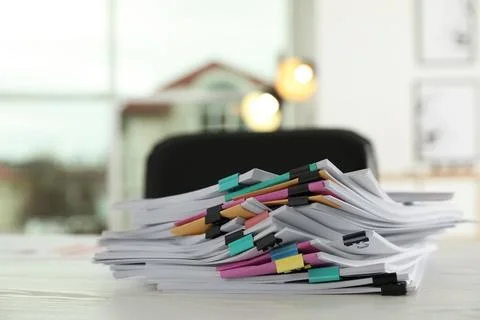 Stack of documents with paper clips on office table. Space for text 스톡 사진
