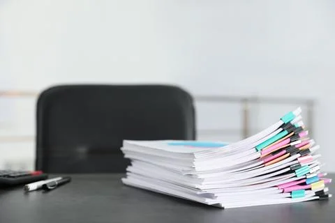 Stack of documents with paper clips on office table. Space for text Stock Photos