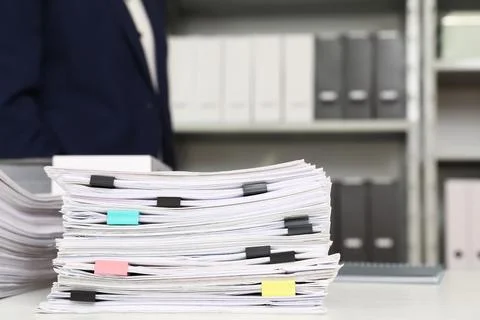 Stack of documents with paper clips on office desk. Space for text Stockfoto's