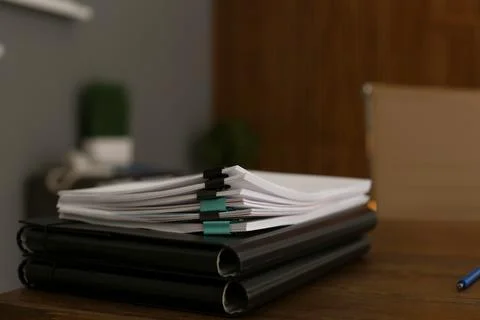 Stack of documents on wooden table in office. Space for text Stock Photos