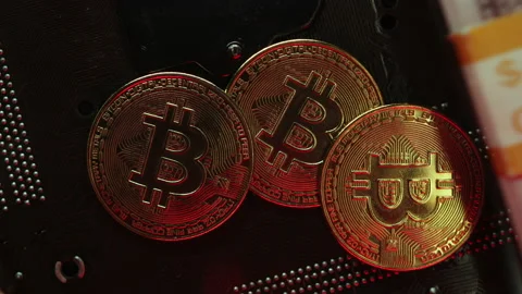 Stack of dollar and euro banknotes opening up and bitcoin's appear in the middle Stock Footage 154630991