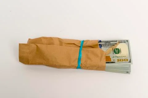 Stack of dollar banknotes and brown envelope Foto stock