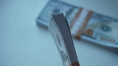 Stack of dollar bills in hand Stock Photos