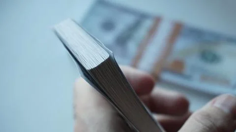 Stack of dollar bills in hand Stock Photos