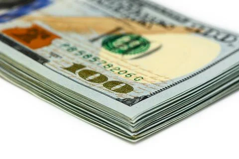 Stack of dollars with angry face of Franklin 1 Foto stock