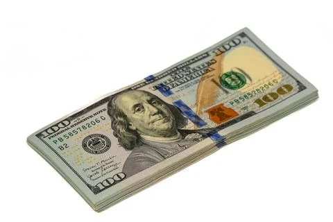 Stack of dollars with angry face of Franklin Foto stock