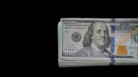 Stack of Dollars comes out of the corner on a Black background Stock Footage 127182986