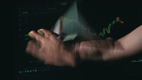 Stack of Dollars Falls Into a Hand Against the Background of a Stock Market Stock Footage 201363947