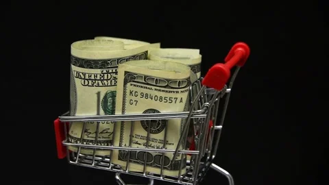 Stack of dollars rotating in trolley from supermarket Video stock 144663134