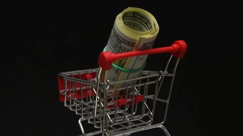 Stack of dollars rotating in trolley from supermarket Stock Footage 144663150