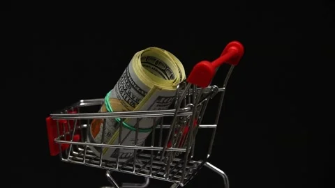 Stack of dollars rotating in trolley from supermarket Stock Footage 144663155