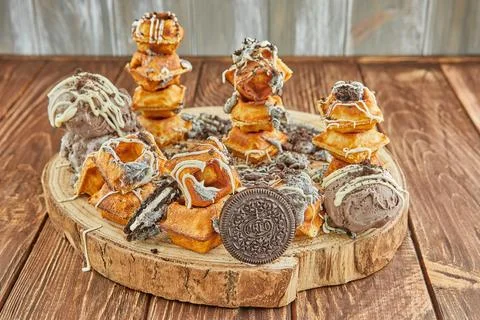 A stack of donuts on a table, a delicious finger food Stock Photos