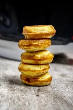 A stack of donuts on a table Stock Photos