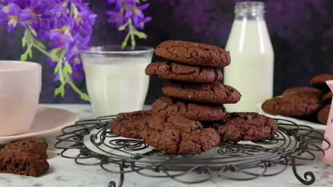 Stack of double chocolate chip homemade cookies in creative vintage setting. Stock Footage 132371520