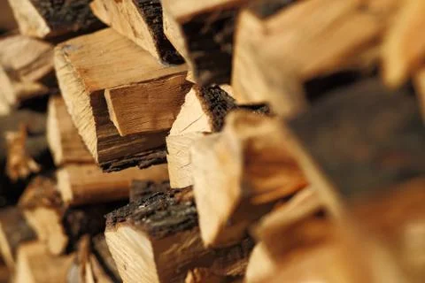Stack of dry chopped firewood. Background of a pile Stock Photos