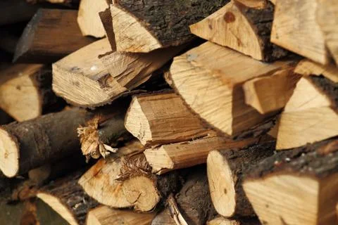 Stack of dry chopped firewood. Background of a pile Stock Photos