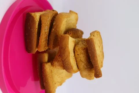 Stack of dry toast on Plastics plate. Close Up Pile of toasted bread slices.  Stock Photos