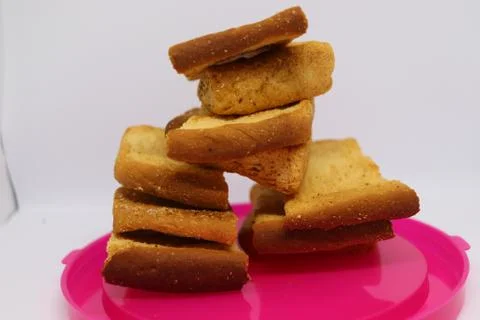 Stack of dry toast on Plastics plate. Close Up Pile of toasted bread slices.  Stock Photos