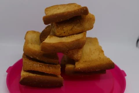 Stack of dry toast on Plastics plate. Close Up Pile of toasted bread slices.  Stock Photos