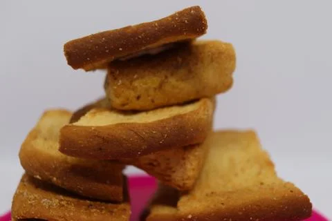 Stack of dry toast on Plastics plate. Close Up Pile of toasted bread slices.  Stock Photos